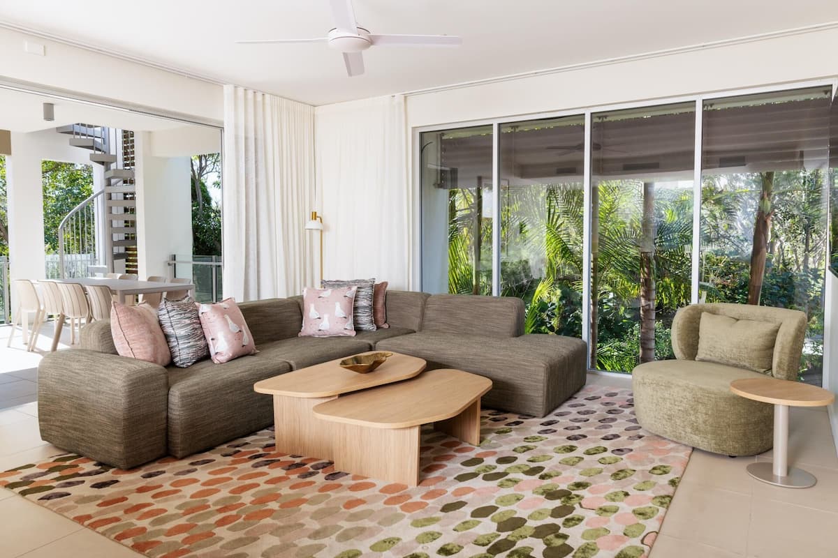 Three Bedroom Apartment | Living area | 55-inch flat-screen TV with digital channels, pay movies