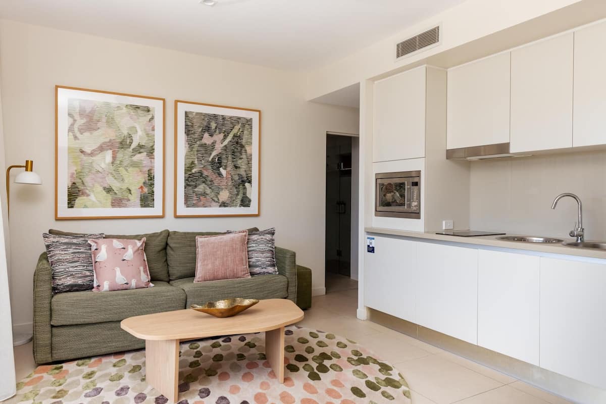 One Bedroom Apartment | Living area | 55-inch flat-screen TV with digital channels, pay movies