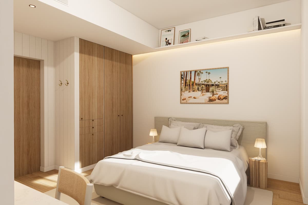 A bedroom with a bed, bedside tables, a wardrobe, and a painting on the wall.