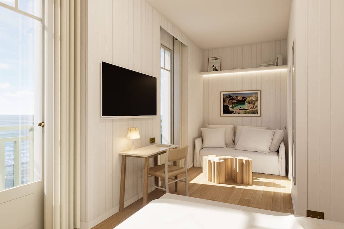 A room with a bed, a desk, a chair, a TV, a painting, and a window with a view.