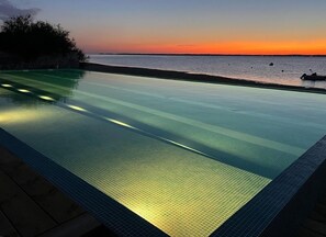 Seasonal outdoor pool, open 9:00 AM to 8:00 PM, pool loungers