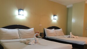 Two single beds with white linens, headboards, and bedside tables. - Sampaguita Suites Plaza Garcia (Cebu City)