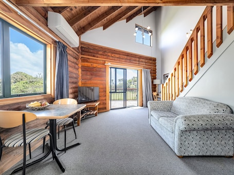 Spa Beachfront Chalet | Living area | LCD TV, DVD player