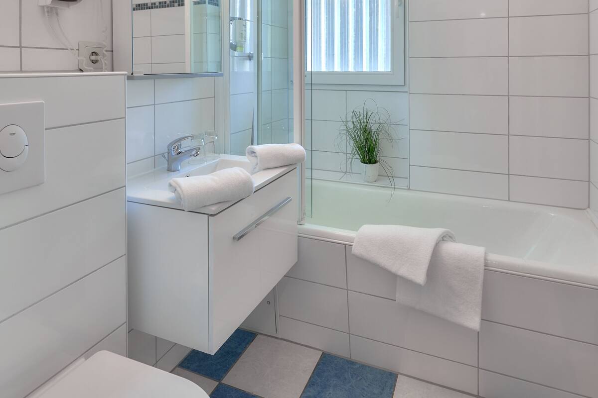 standard double room | bathroom | deep-soaking bathtub, hair dryer, towels