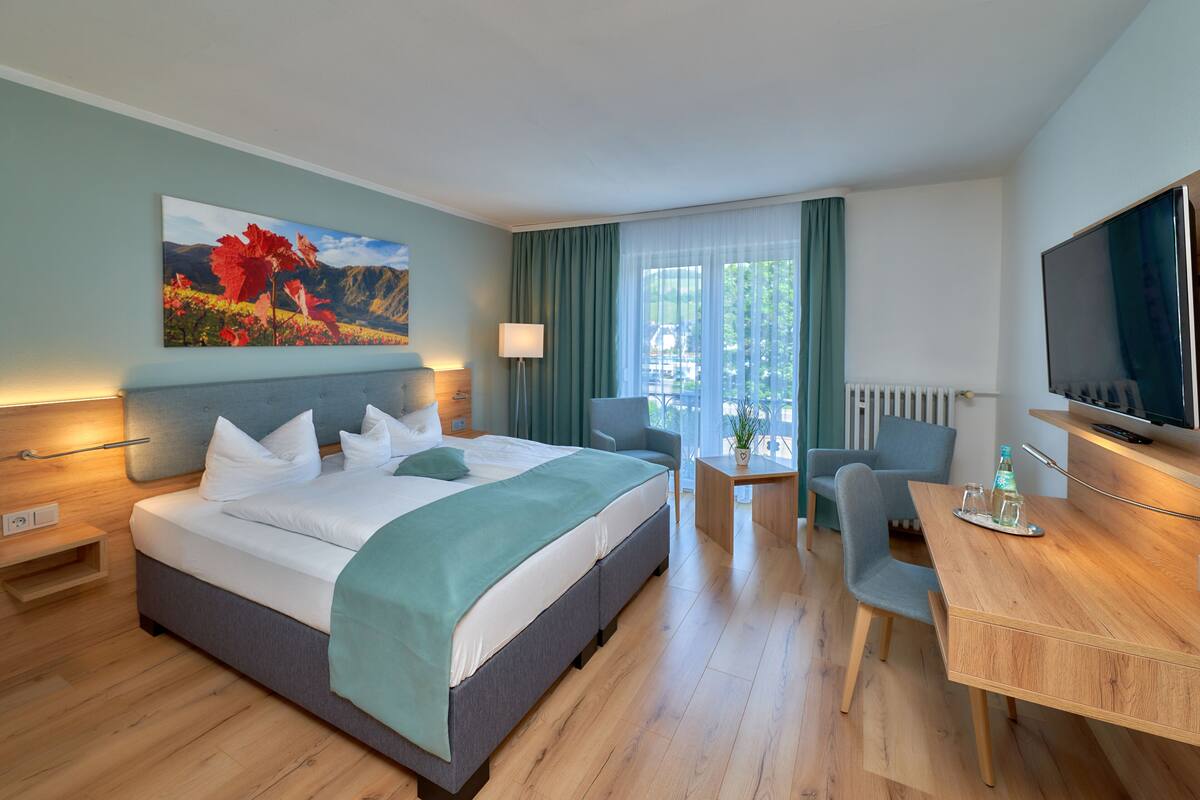 double room, river view | minibar, in-room safe, desk, free cots/infant beds