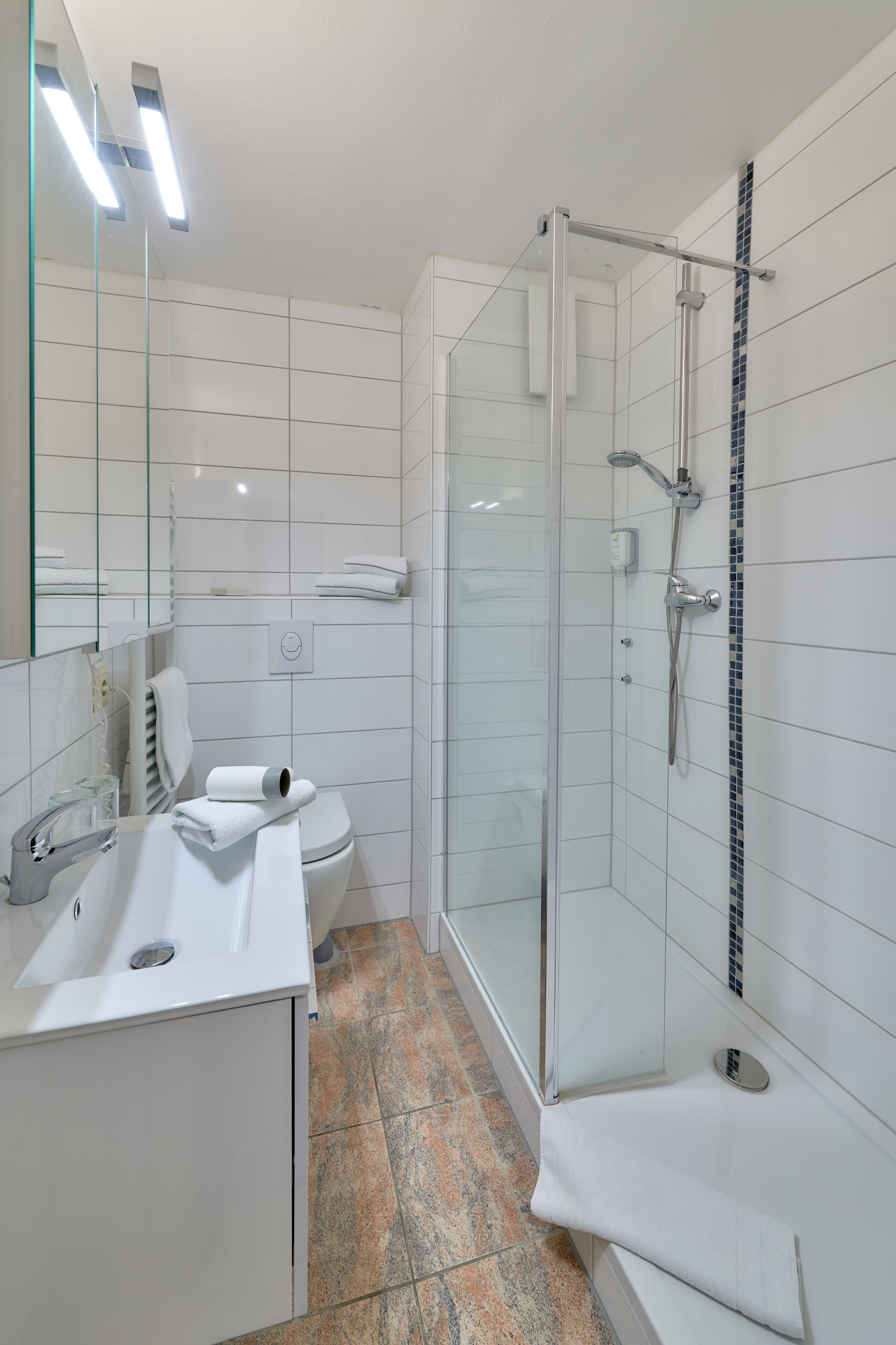 deep-soaking bathtub, hair dryer, towels