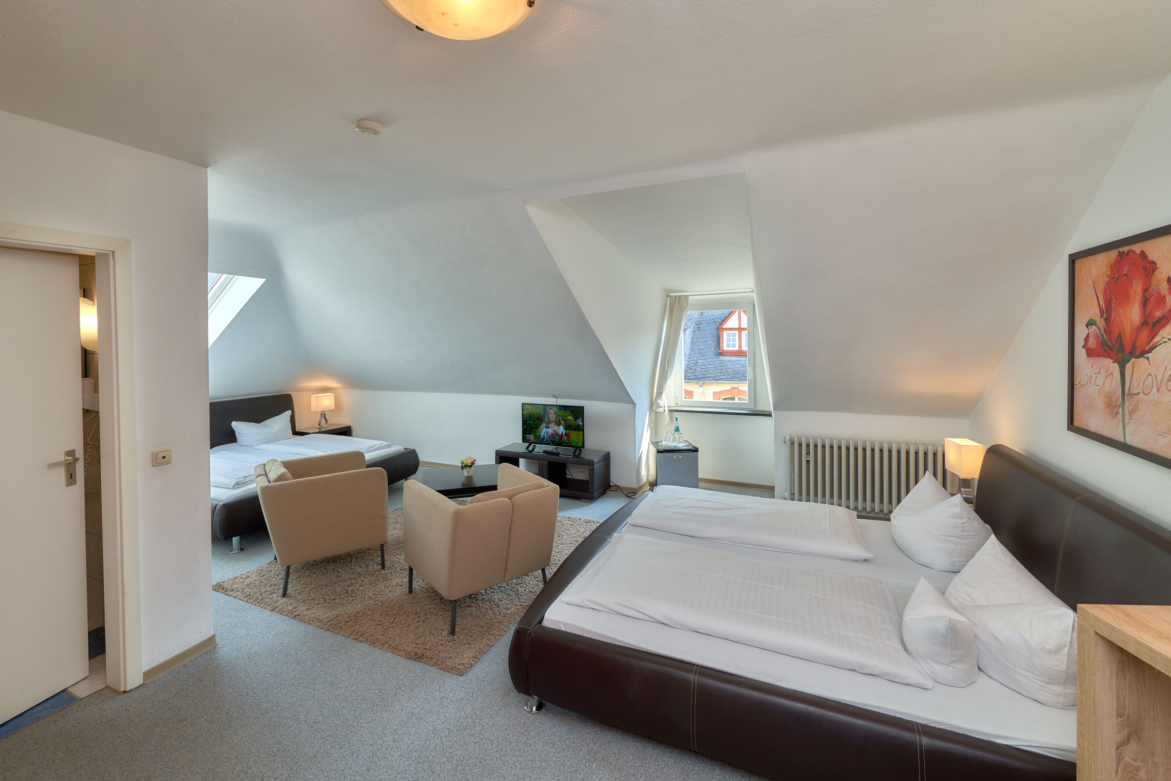 family room | minibar, in-room safe, desk, free cots/infant beds