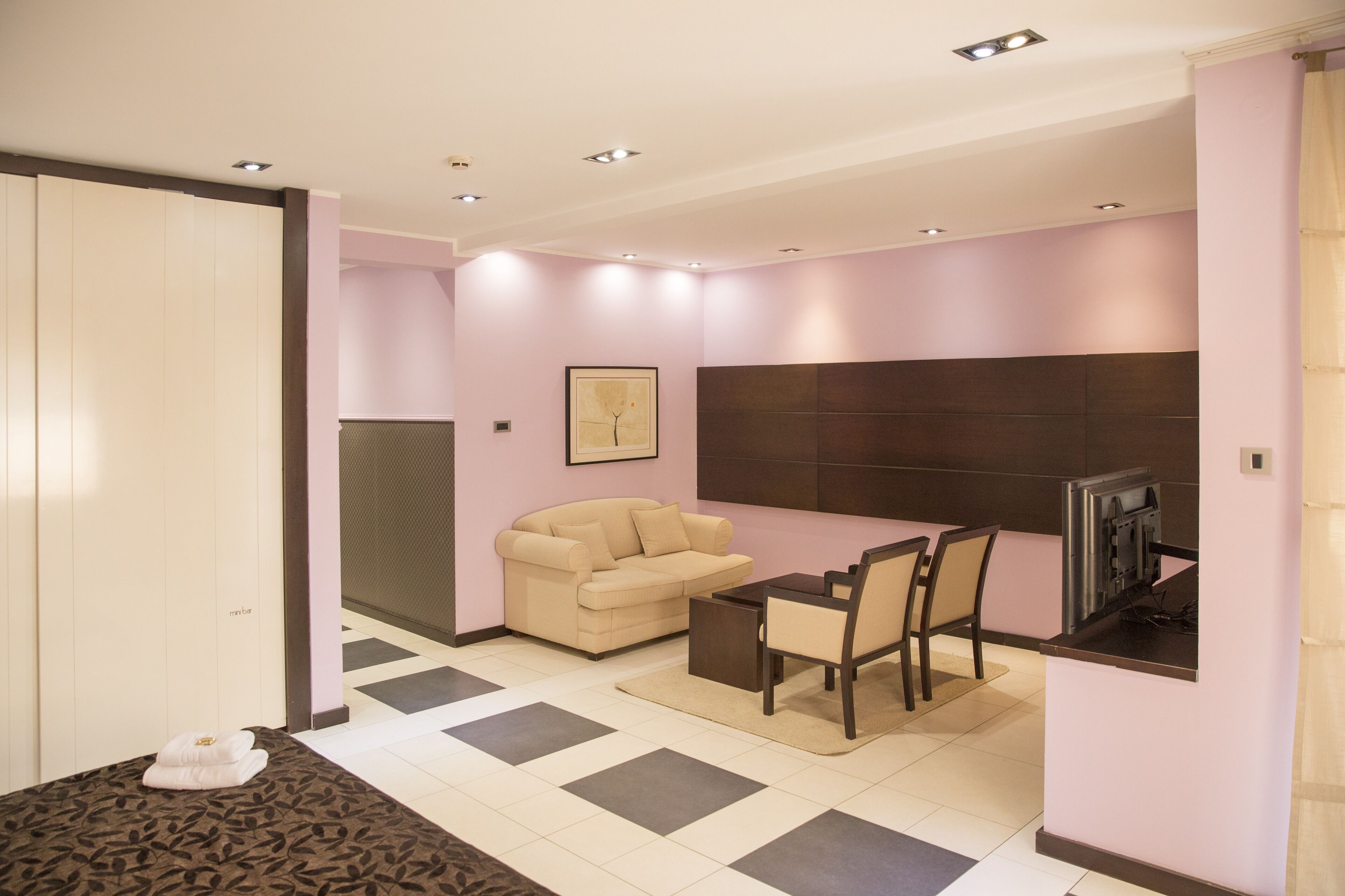 superior double room, terrace | living area | 65-cm lcd tv with cable channels, tv, dvd player