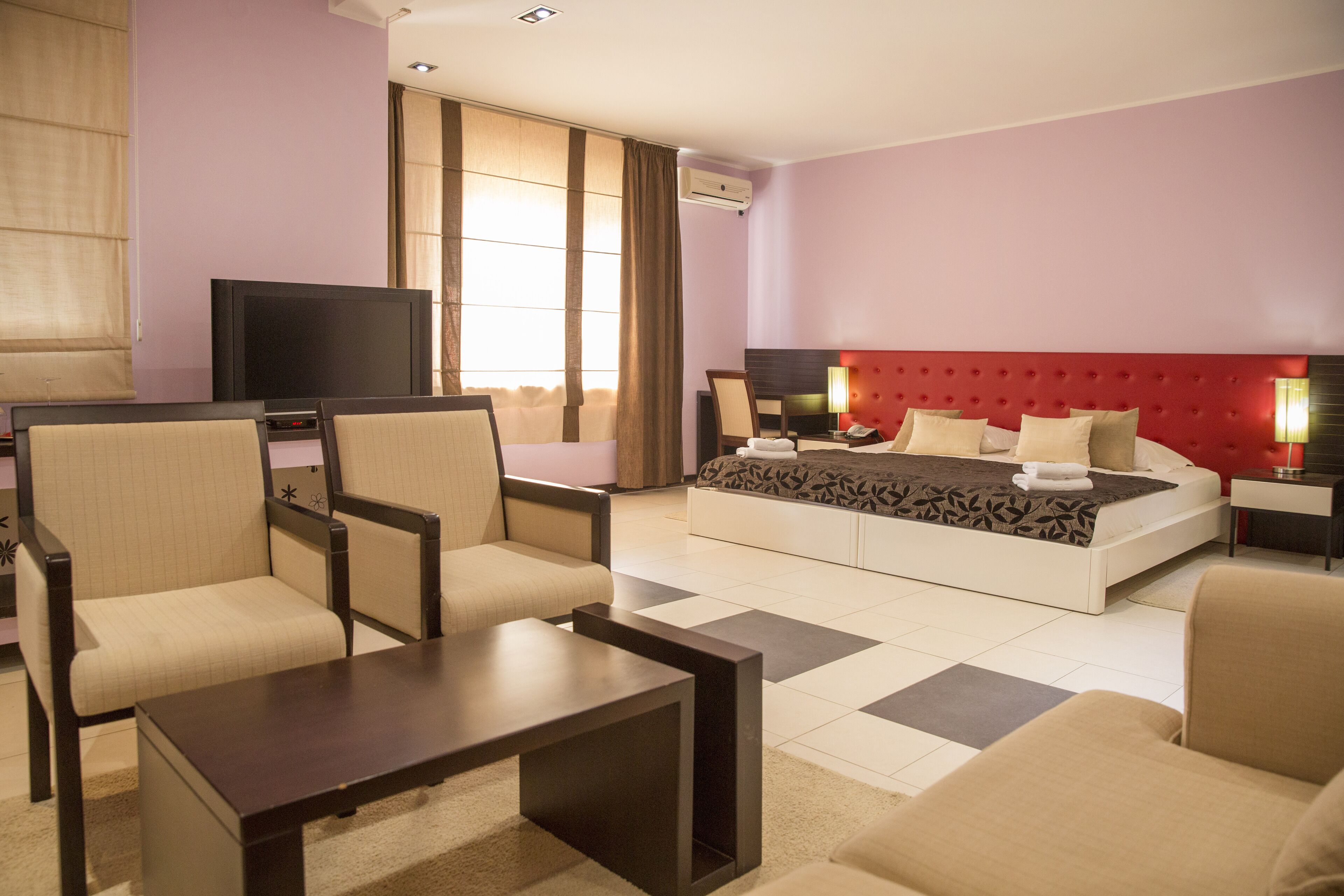 superior double room, terrace | living room | 65-cm lcd tv with cable channels, tv, dvd player