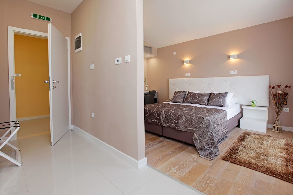 superior double room, balcony, partial sea view | premium bedding, memory-foam beds, minibar, in-room safe