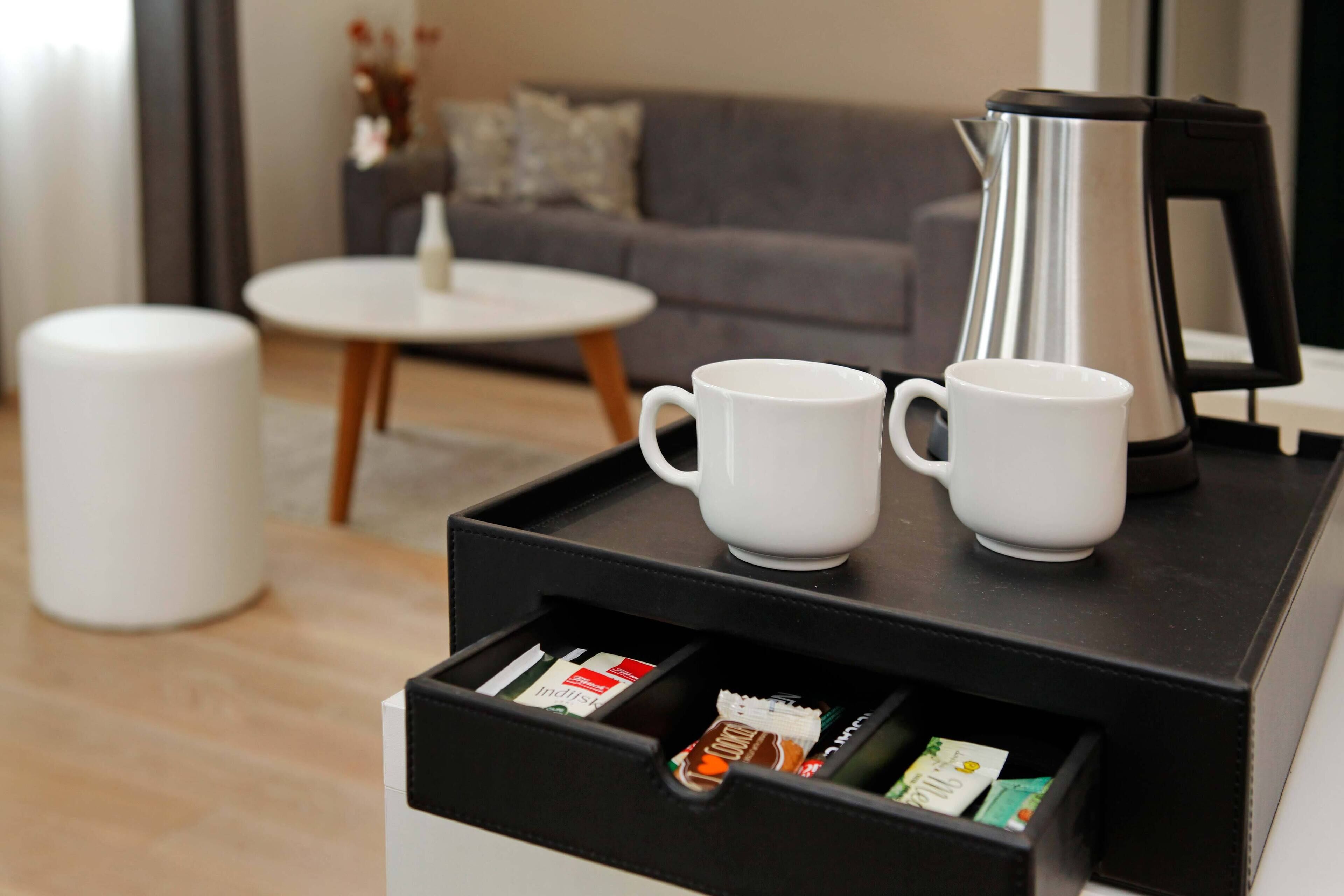 executive double room, balcony, sea view | living area | led tv