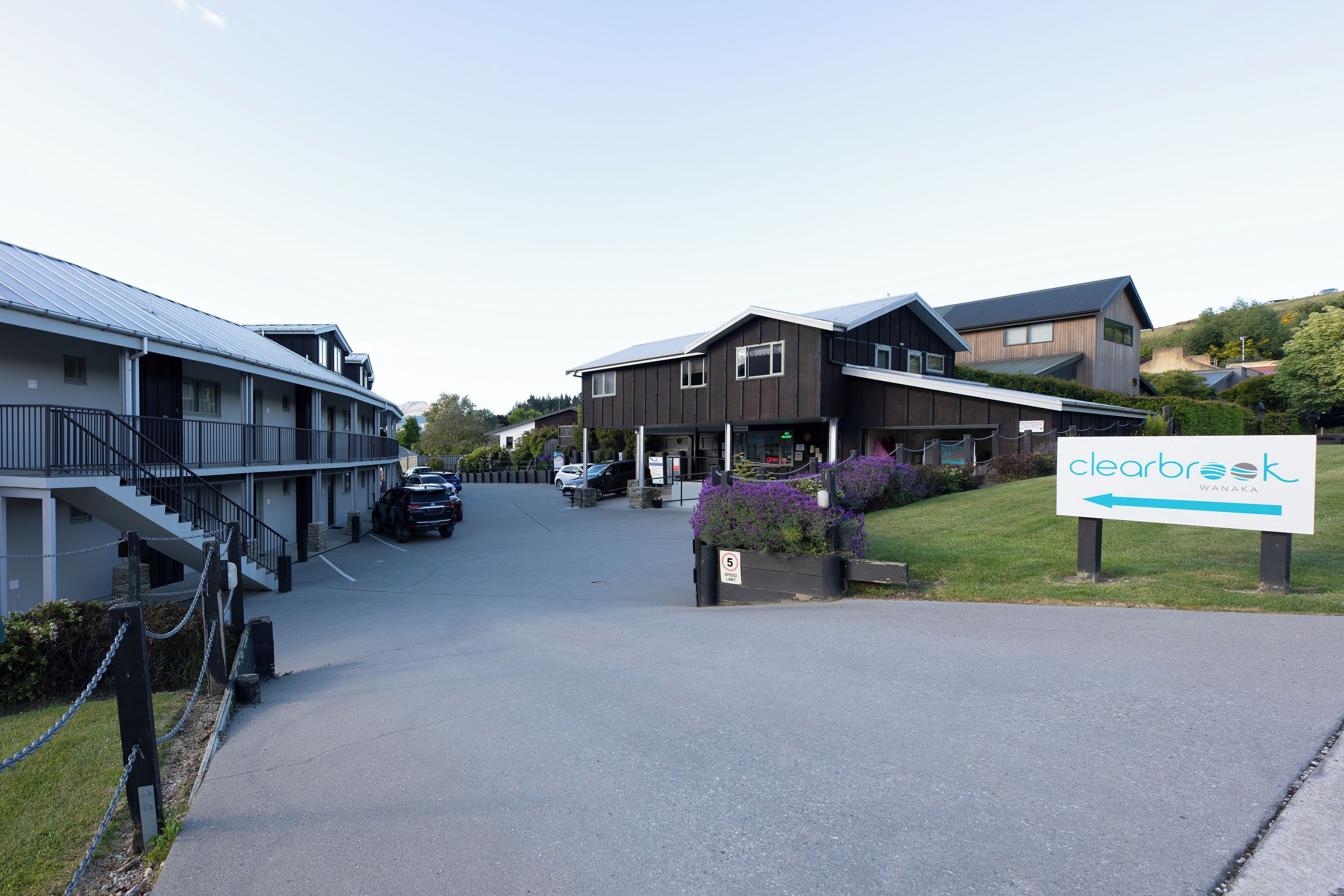 A hotel with a sign indicating 'Clearbrook Wanaka'.
