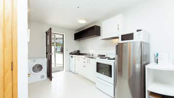 Studio Apartment | Private kitchen | Full-size fridge, microwave, oven, stovetop