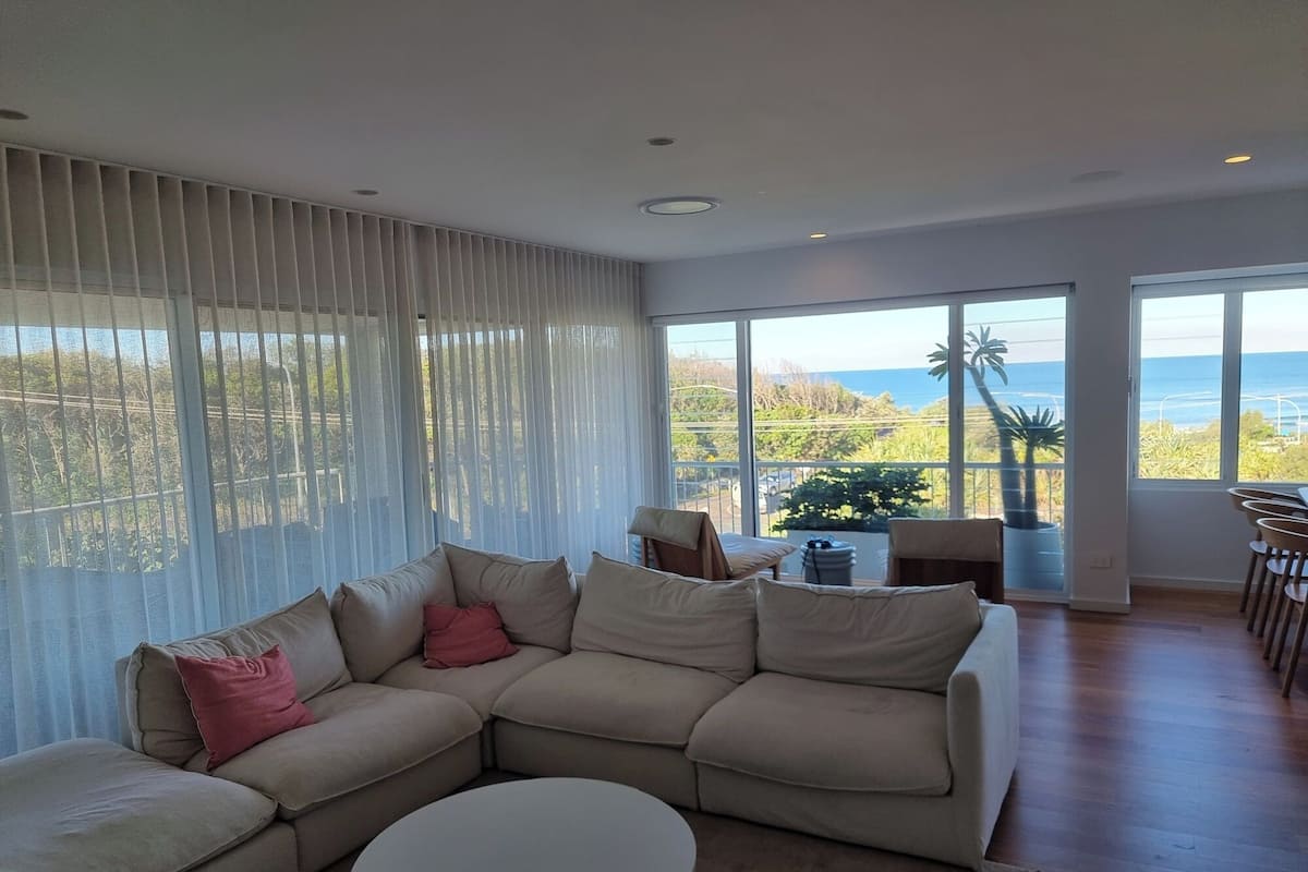 Deluxe Apartment | Living area | 50-inch TV with cable channels, DVD player