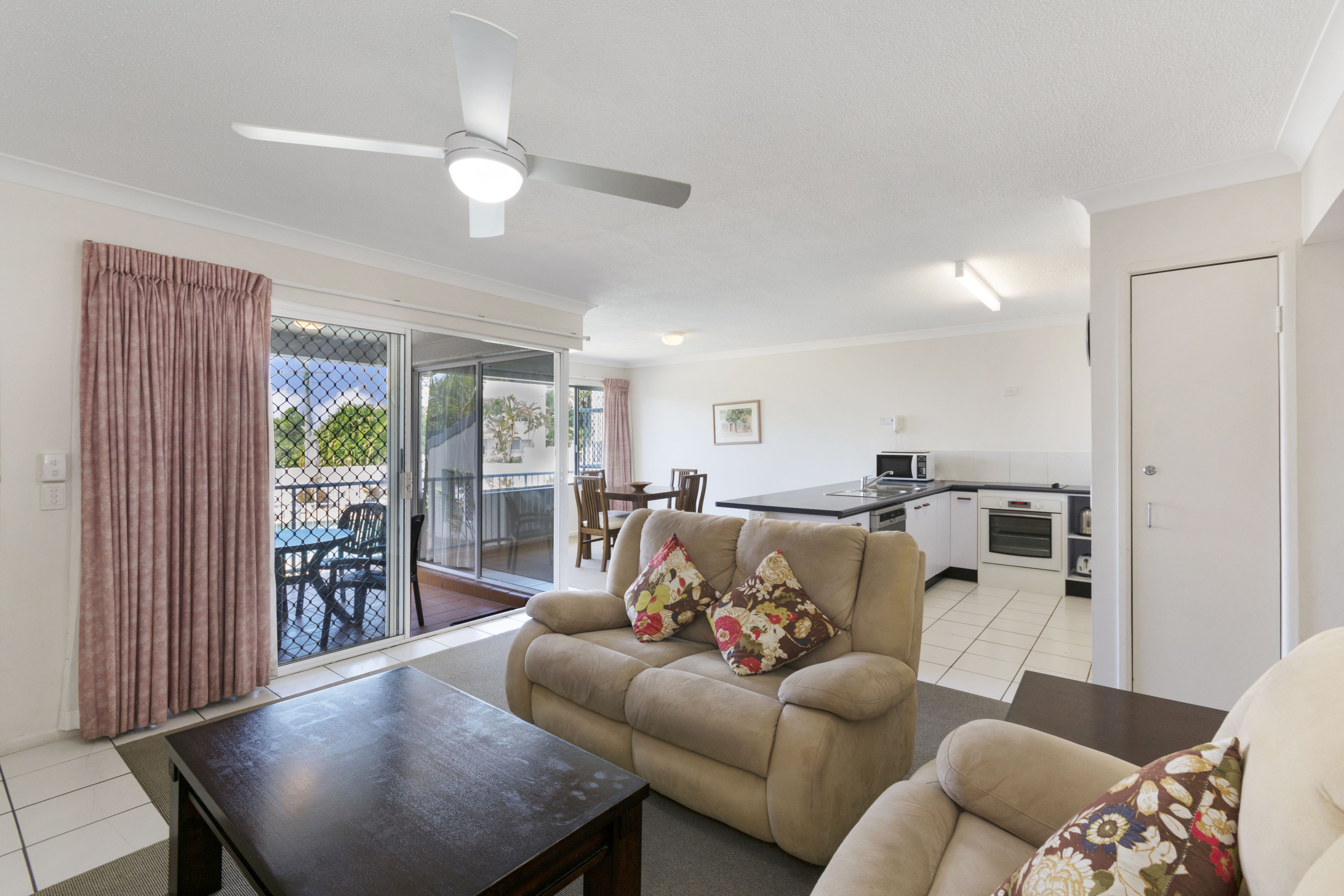 standard apartment, 1 queen bed, ocean view, beachside | living area | 50-inch tv with cable channels, dvd player