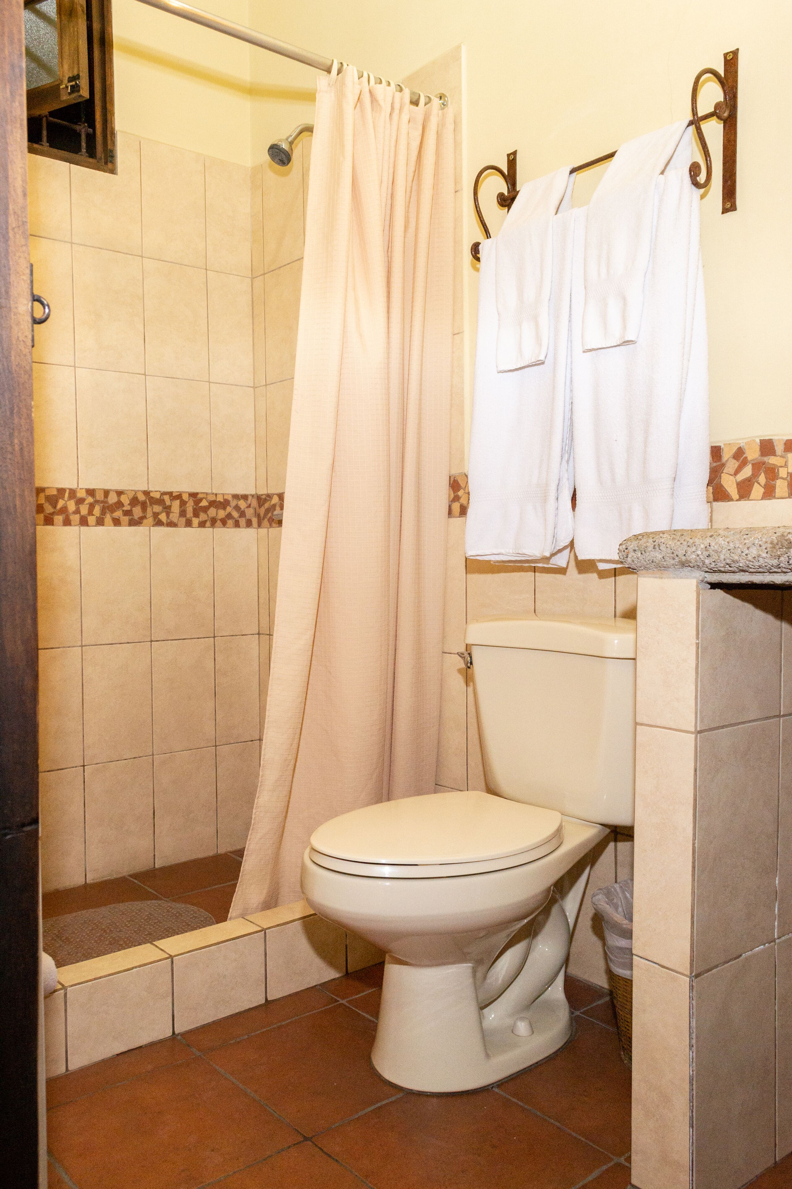 studio suite | bathroom | shower, hair dryer, towels