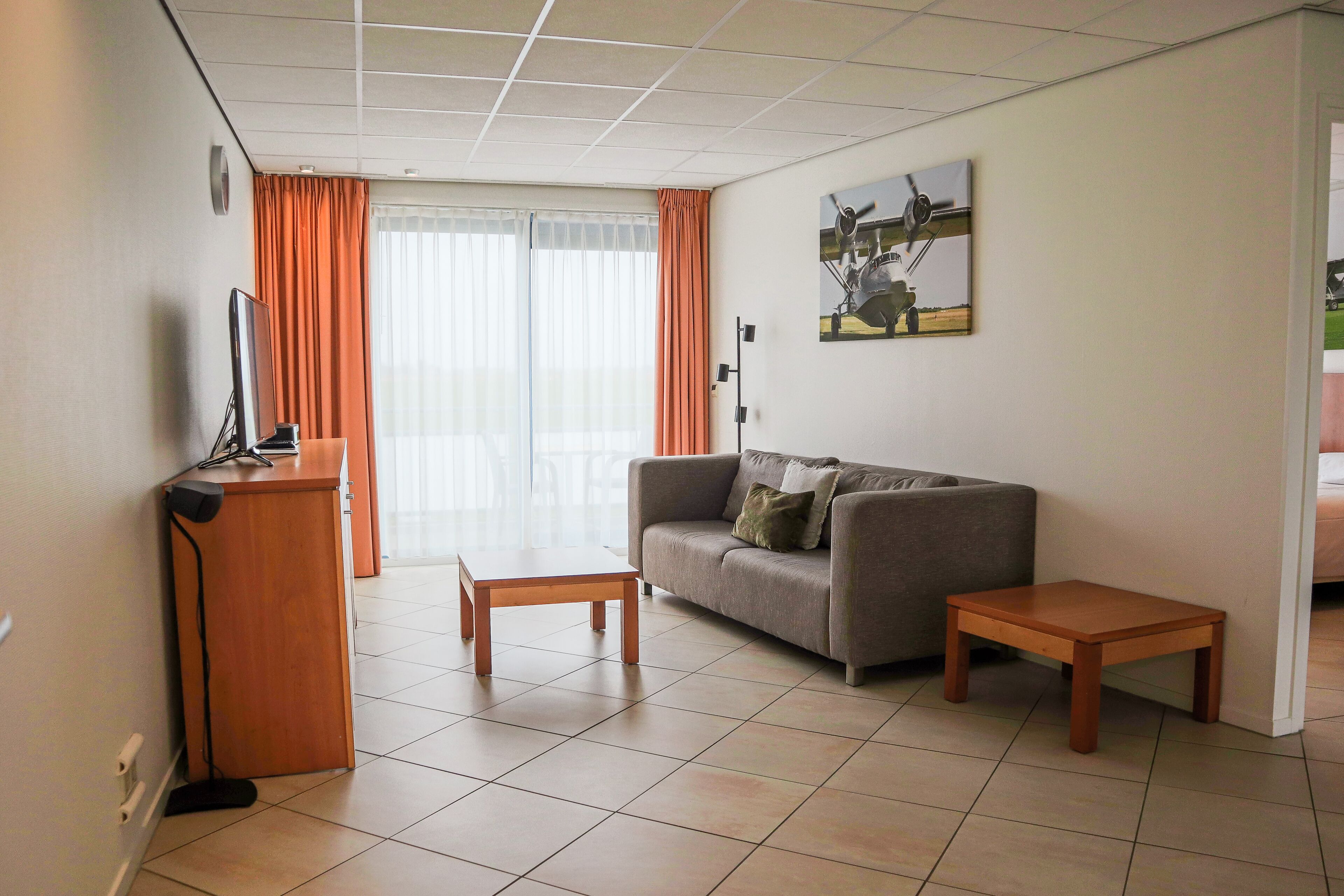 royal suite, 1 bedroom | living area | 52-cm smart tv with cable channels, tv, dvd player