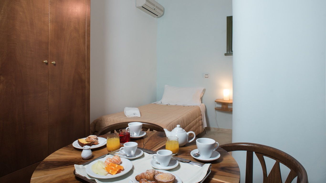 superior triple room | minibar, in-room safe, desk, laptop workspace