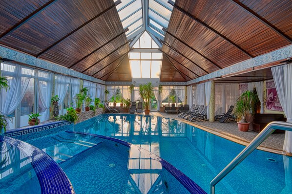 Indoor pool, seasonal outdoor pool, pool umbrellas, pool loungers