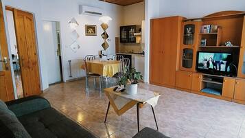 Apartment | Living area | 82-cm LED TV with cable channels, TV