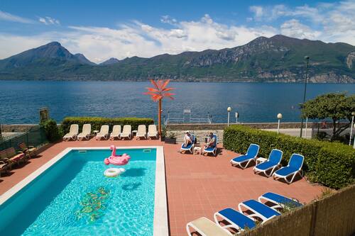 Seasonal outdoor pool, pool umbrellas, pool loungers
