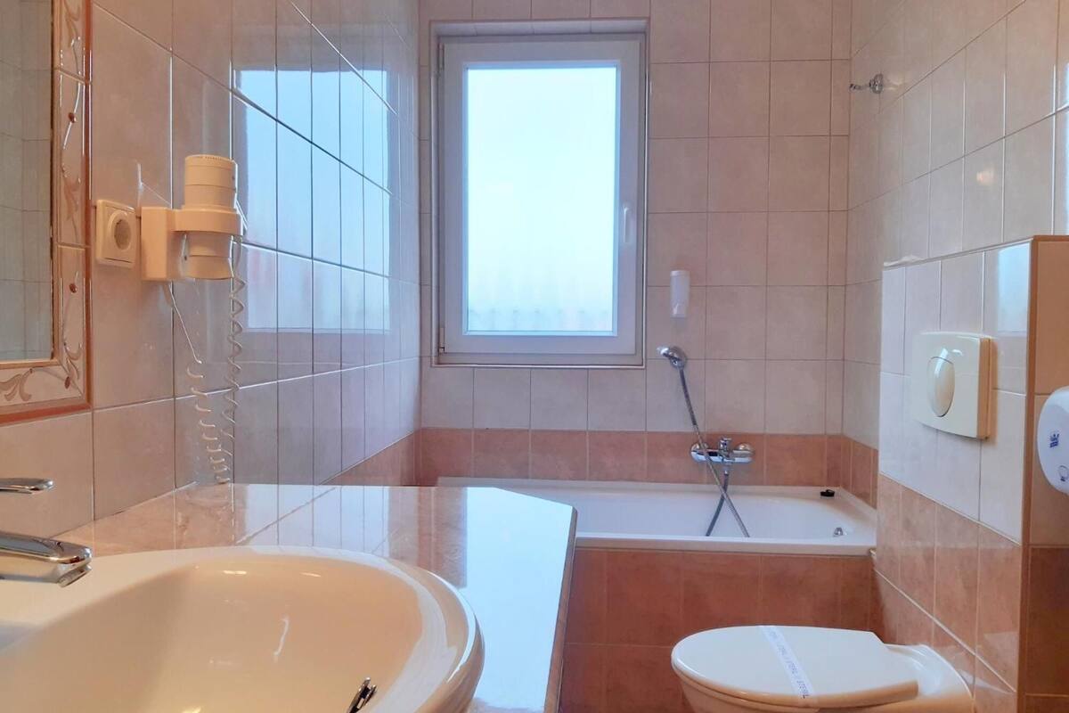 hair dryer, bathrobes, towels