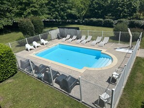 Seasonal outdoor pool, pool umbrellas, pool loungers
