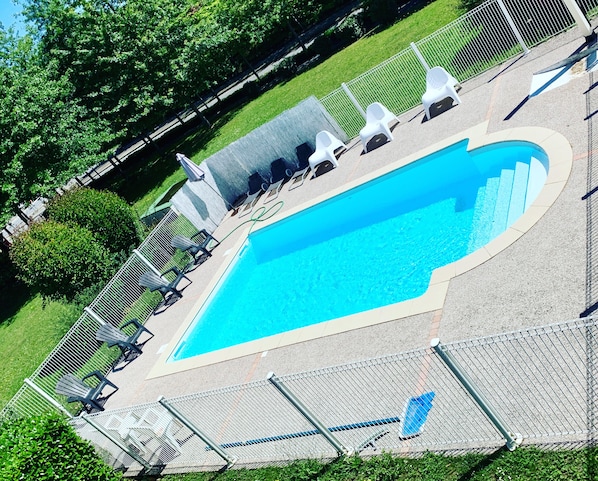 Seasonal outdoor pool, pool umbrellas, pool loungers