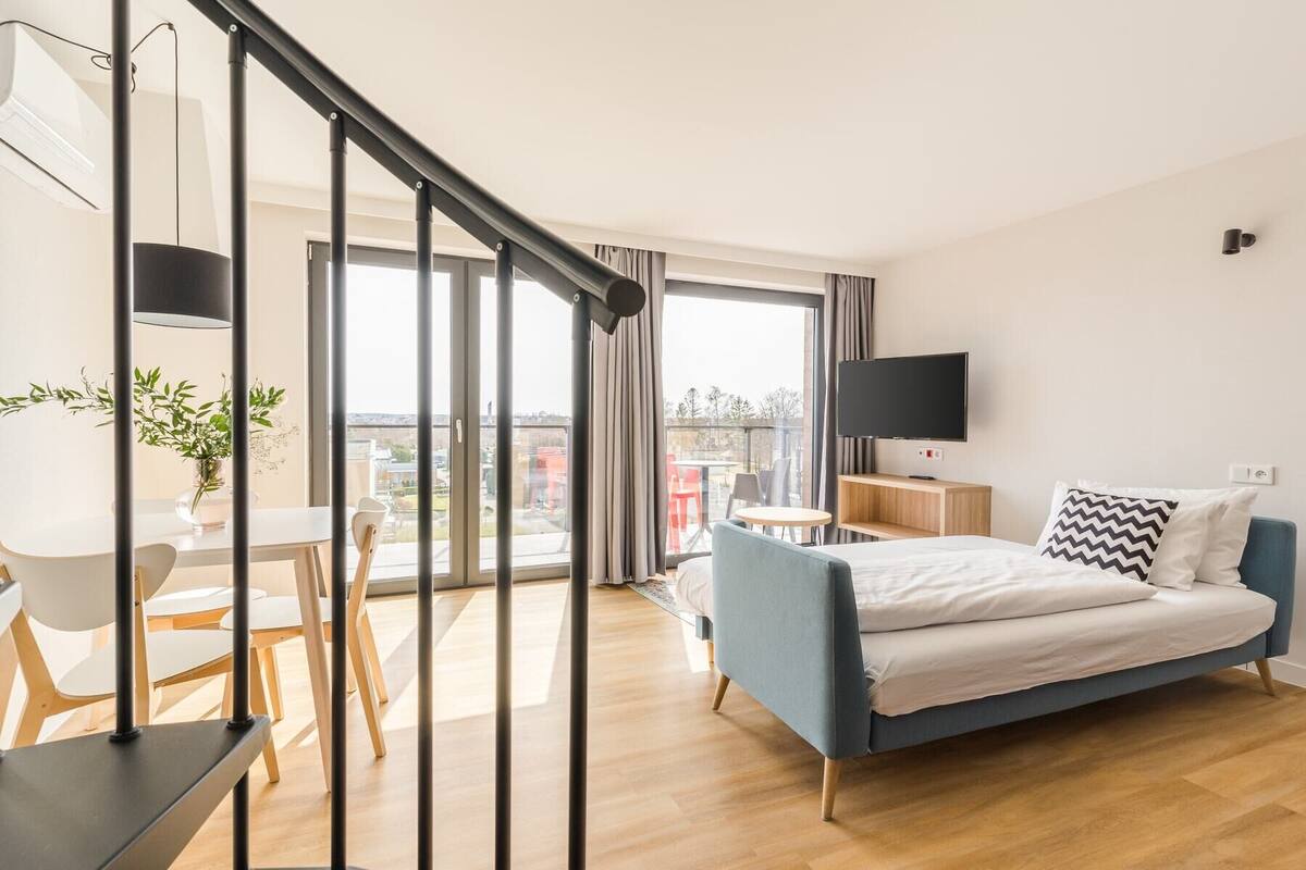 senior apartment | living area | 42-inch lcd tv with satellite channels, books