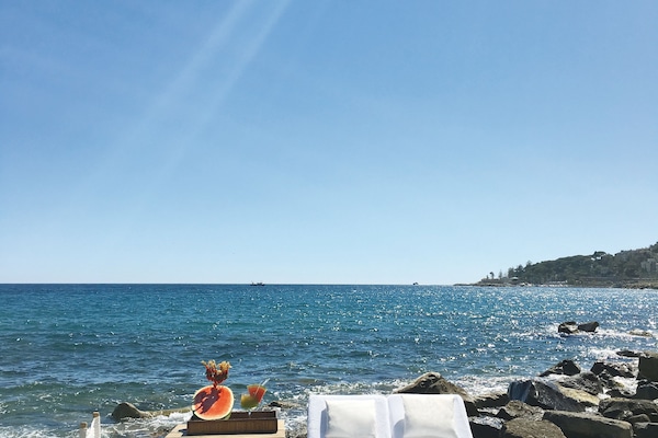 Private beach, black sand, sun loungers, beach umbrellas