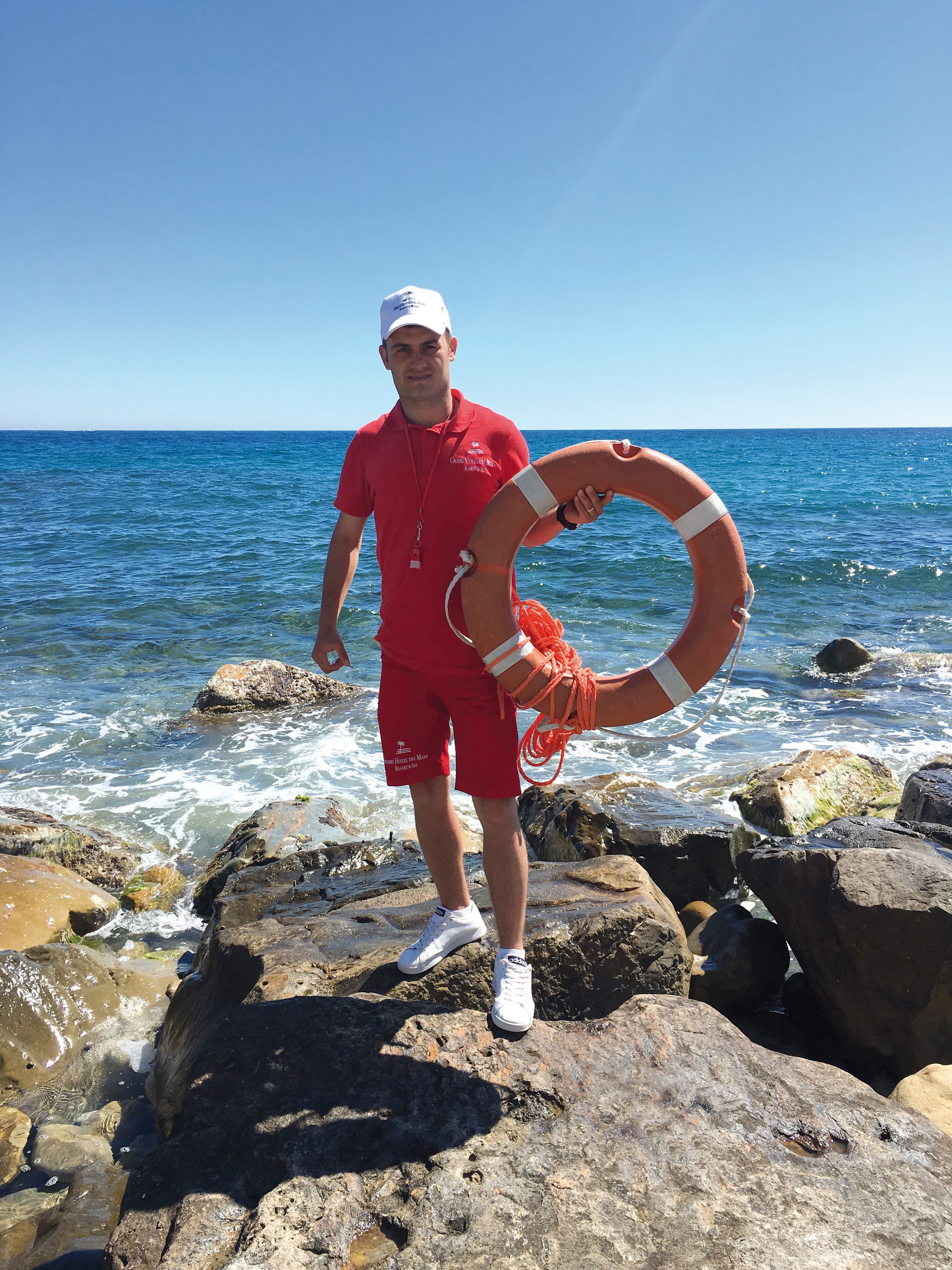 private beach, black sand, sun-loungers, beach umbrellas