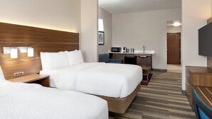 A hotel room with a large bed, bedside tables, a desk with a chair, a microwave, and a TV. - Holiday Inn Express Hotel & Suites Waycross by IHG (Waycross)
