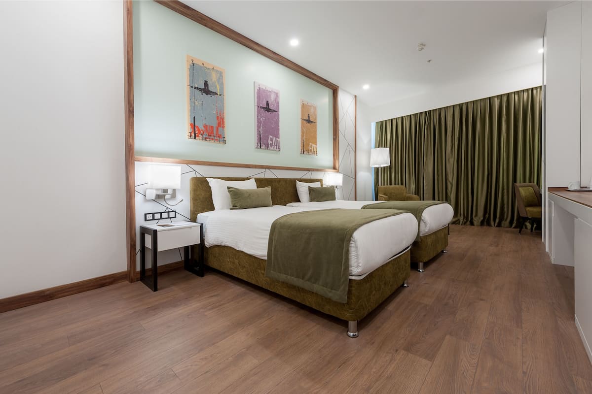 exclusive deluxe room | hypo-allergenic bedding, in-room safe, blackout curtains, soundproofing