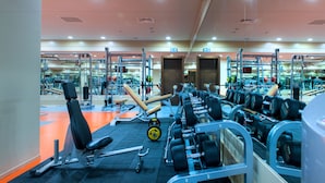 A gym with various exercise equipment, including dumbbells, benches, and weight machines. - ISG Sabiha Gokcen Airport Hotel - Special Class (Istanbul)