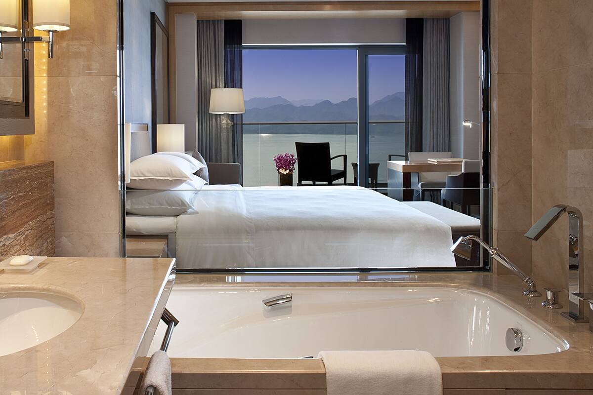 premium room, lake view | bathroom | separate bathtub and shower, free toiletries, hair dryer, bathrobes