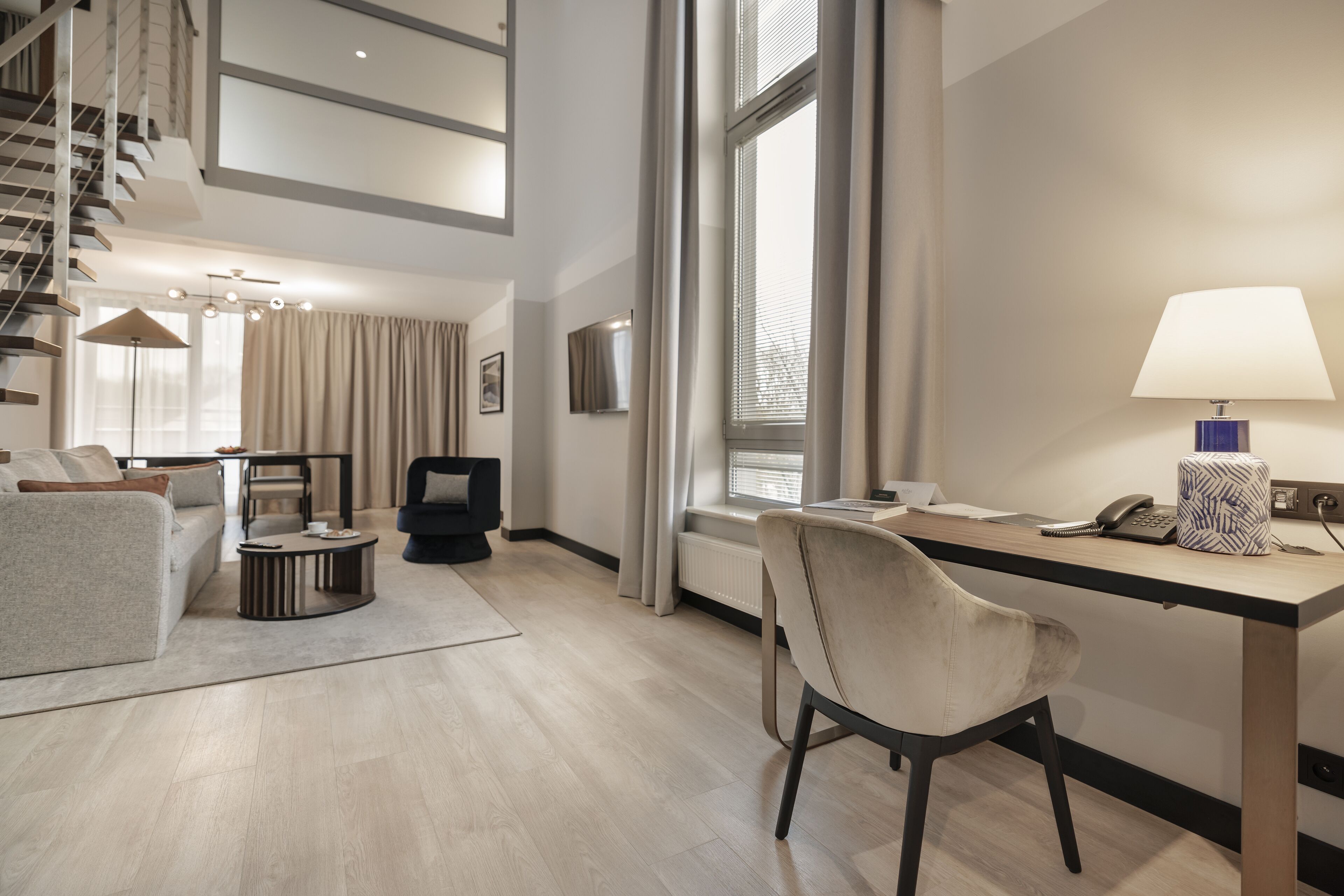 grand suite, 2 bedrooms | living area | 40-inch flat-screen tv with satellite channels