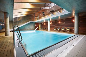 Indoor pool, open 8:00 AM to 8:00 PM, pool loungers