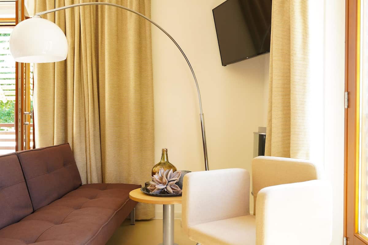 executive room | living area | tv, heated floors