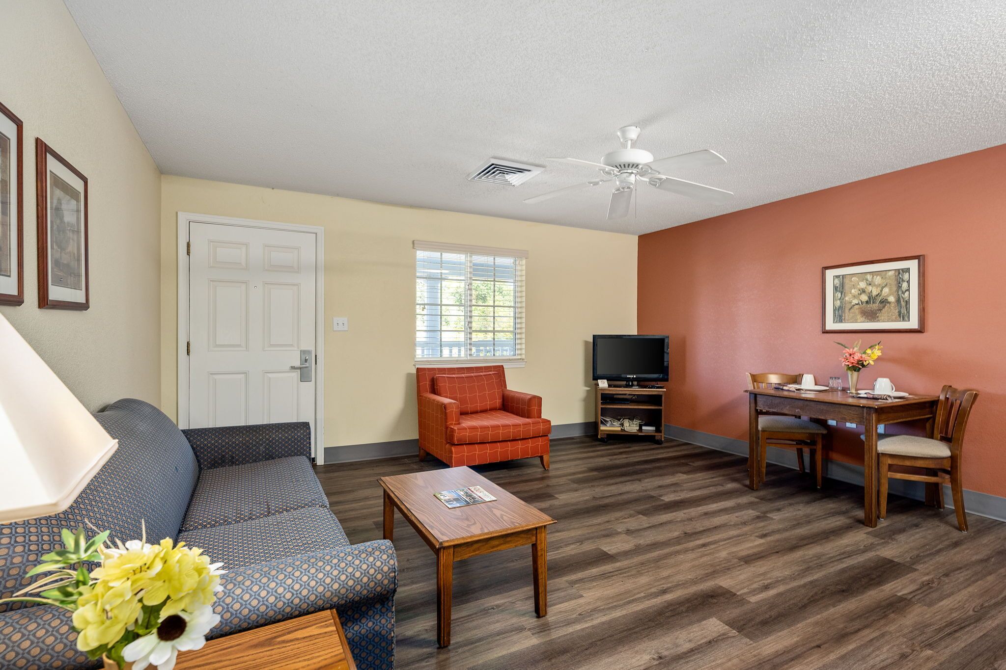 suite, 2 double beds | living area | 32-inch lcd tv with cable channels, tv, dvd player