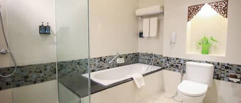 Executive Suite, 1 King Bed | Bathroom | Combined shower/tub, deep soaking tub, eco-friendly toiletries