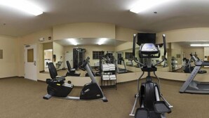 A gym with various exercise equipment, including treadmills, stationary bikes, and weight machines. - Candlewood Suites Minot by IHG (Minot)