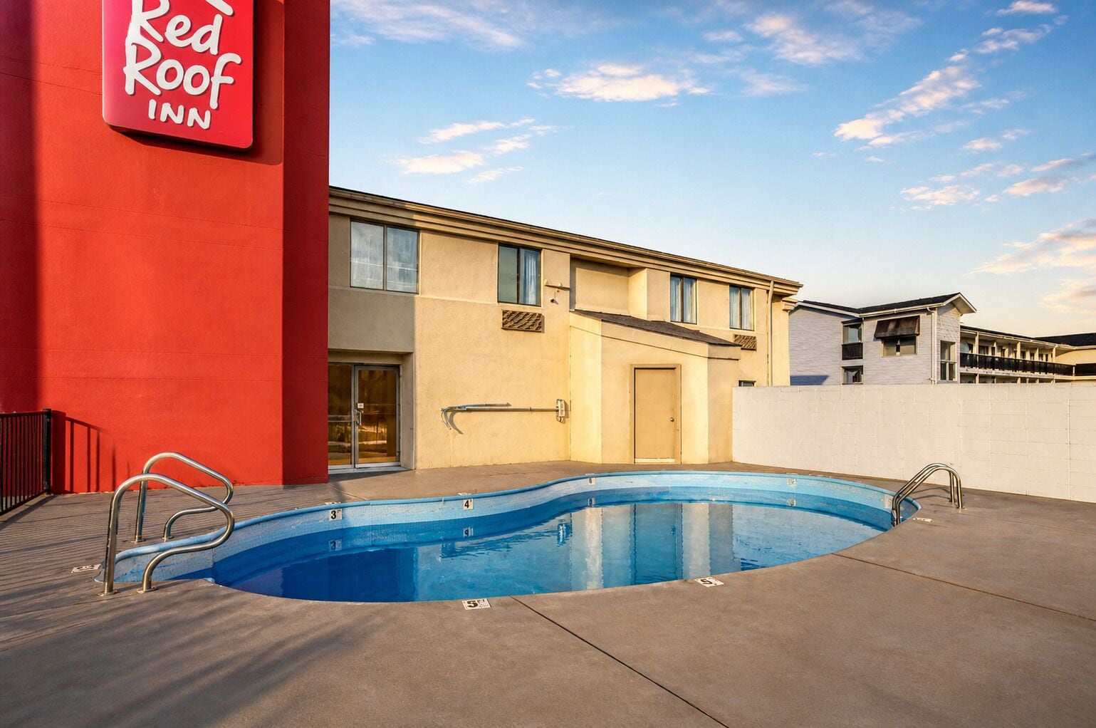 Seasonal outdoor pool, open 9:00 AM to 9:00 PM, pool umbrellas