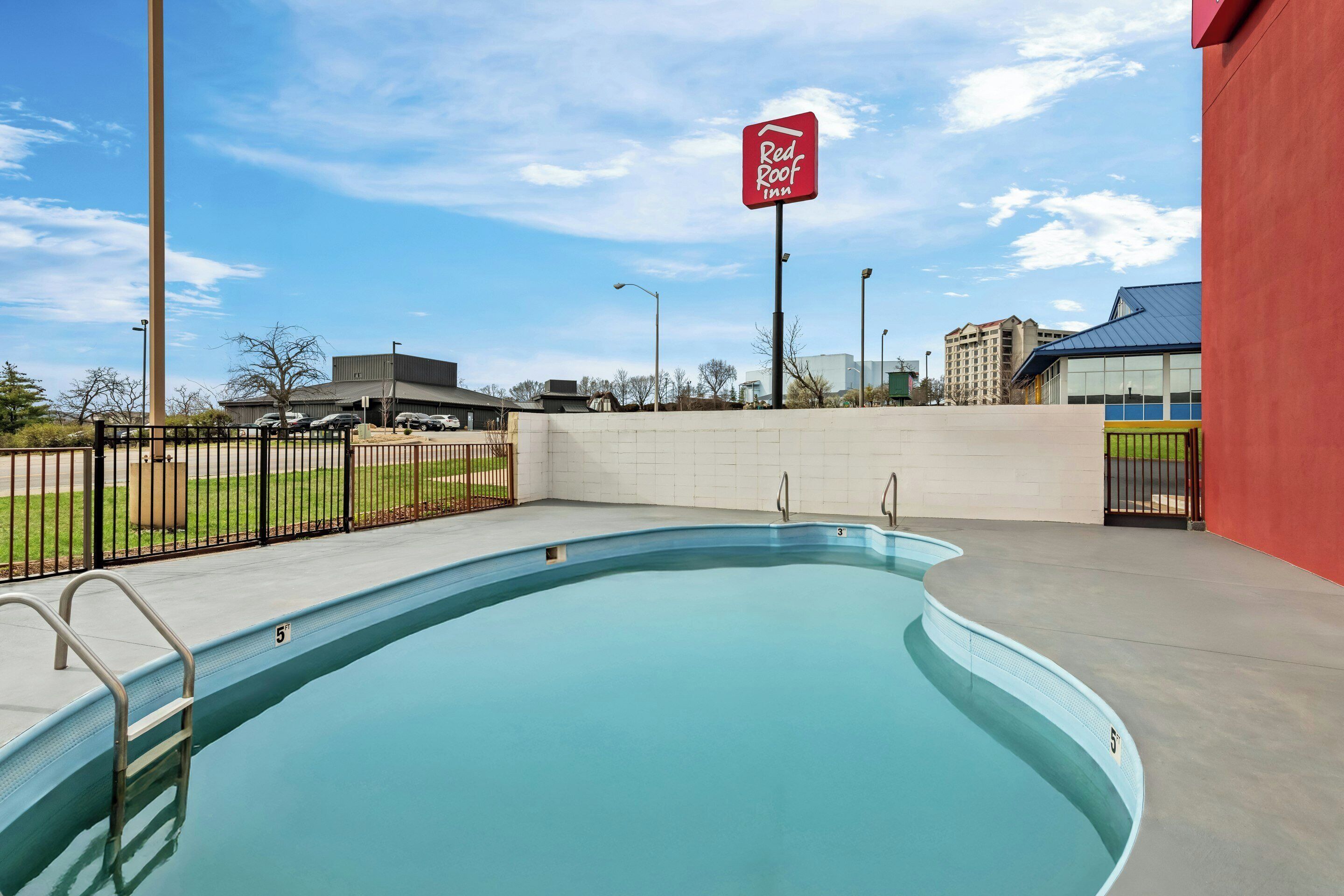 Seasonal outdoor pool, open 9:00 AM to 9:00 PM, pool umbrellas