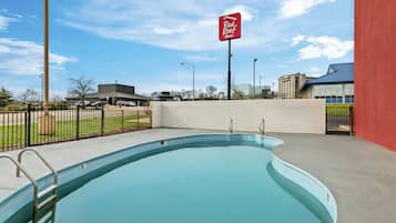 Seasonal outdoor pool, open 9:00 AM to 9:00 PM, pool umbrellas