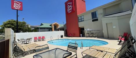 Seasonal outdoor pool, open 9:00 AM to 9:00 PM, pool umbrellas