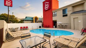 Seasonal outdoor pool, open 9:00 AM to 9:00 PM, pool umbrellas
