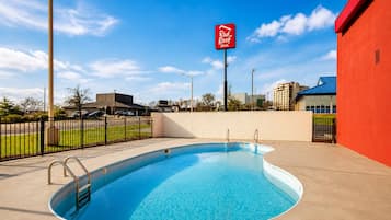 Seasonal outdoor pool, open 9:00 AM to 9:00 PM, pool umbrellas