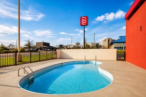 Seasonal outdoor pool, open 9:00 AM to 9:00 PM, pool umbrellas