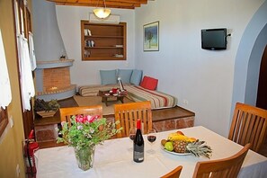 Villa familiar | Área de sala de estar | Televisión de pantalla plana