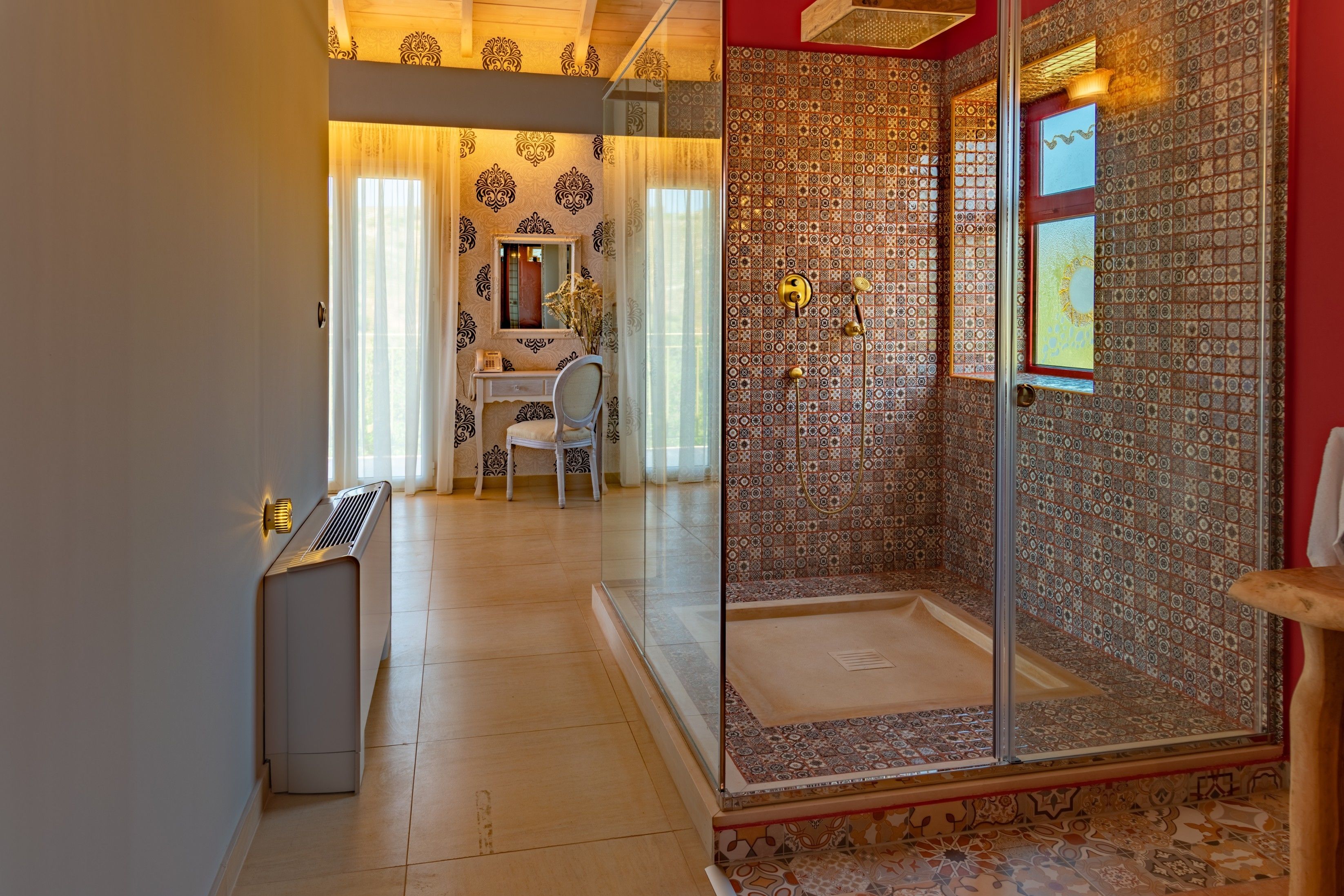 A bathroom with a shower, a sink, and a mirror.